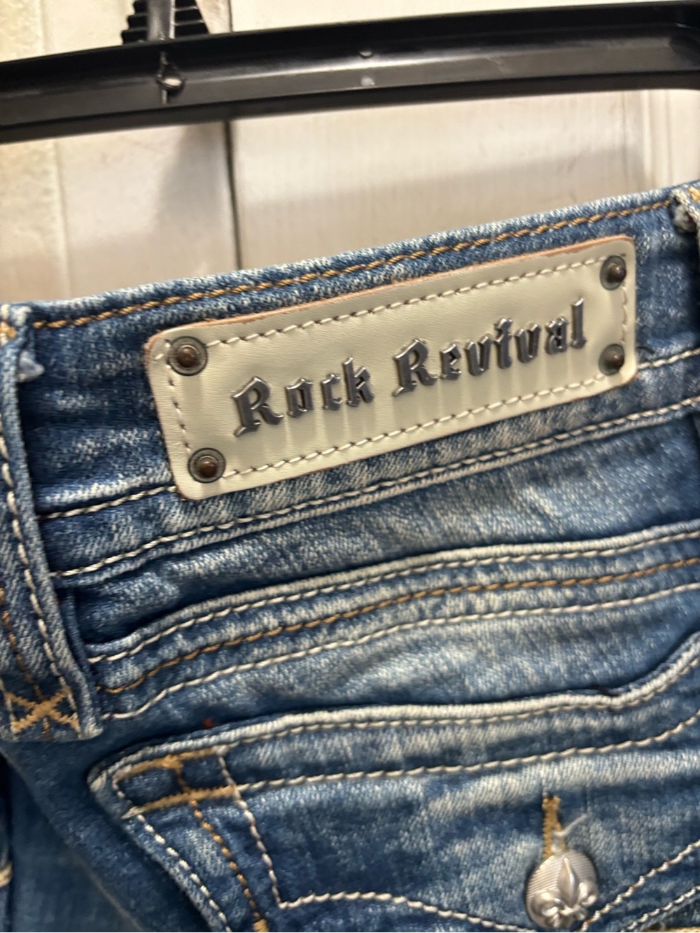 Rock Revival Faded Blue Bootcut Jeans with Subtle Distress